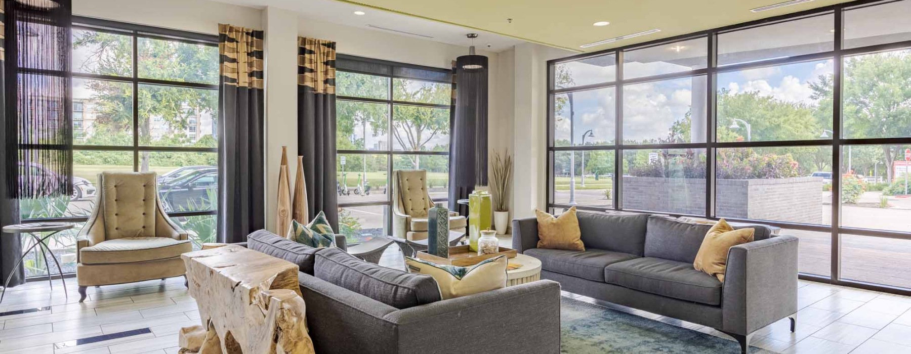 spacious room with couches and chairs